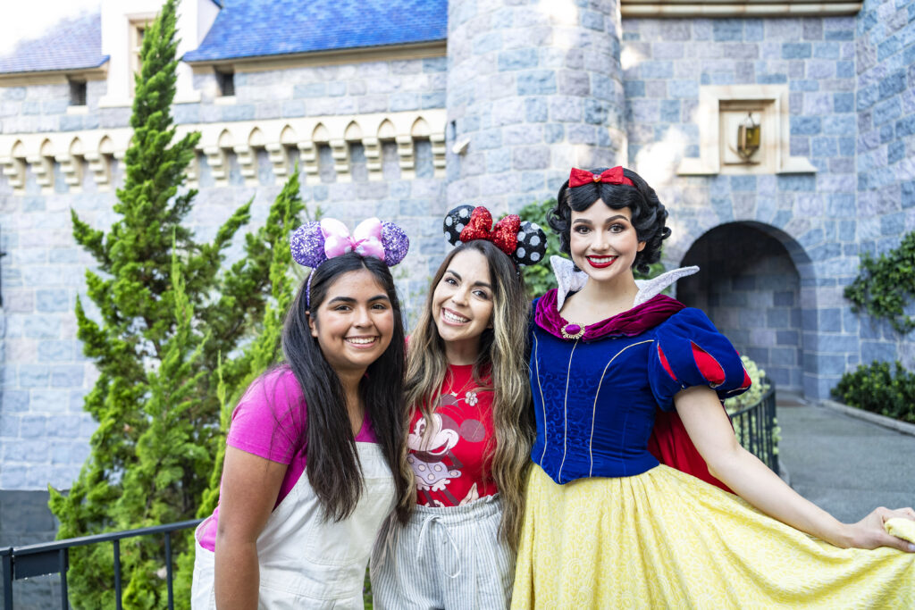 people in front of the Disneyland castle