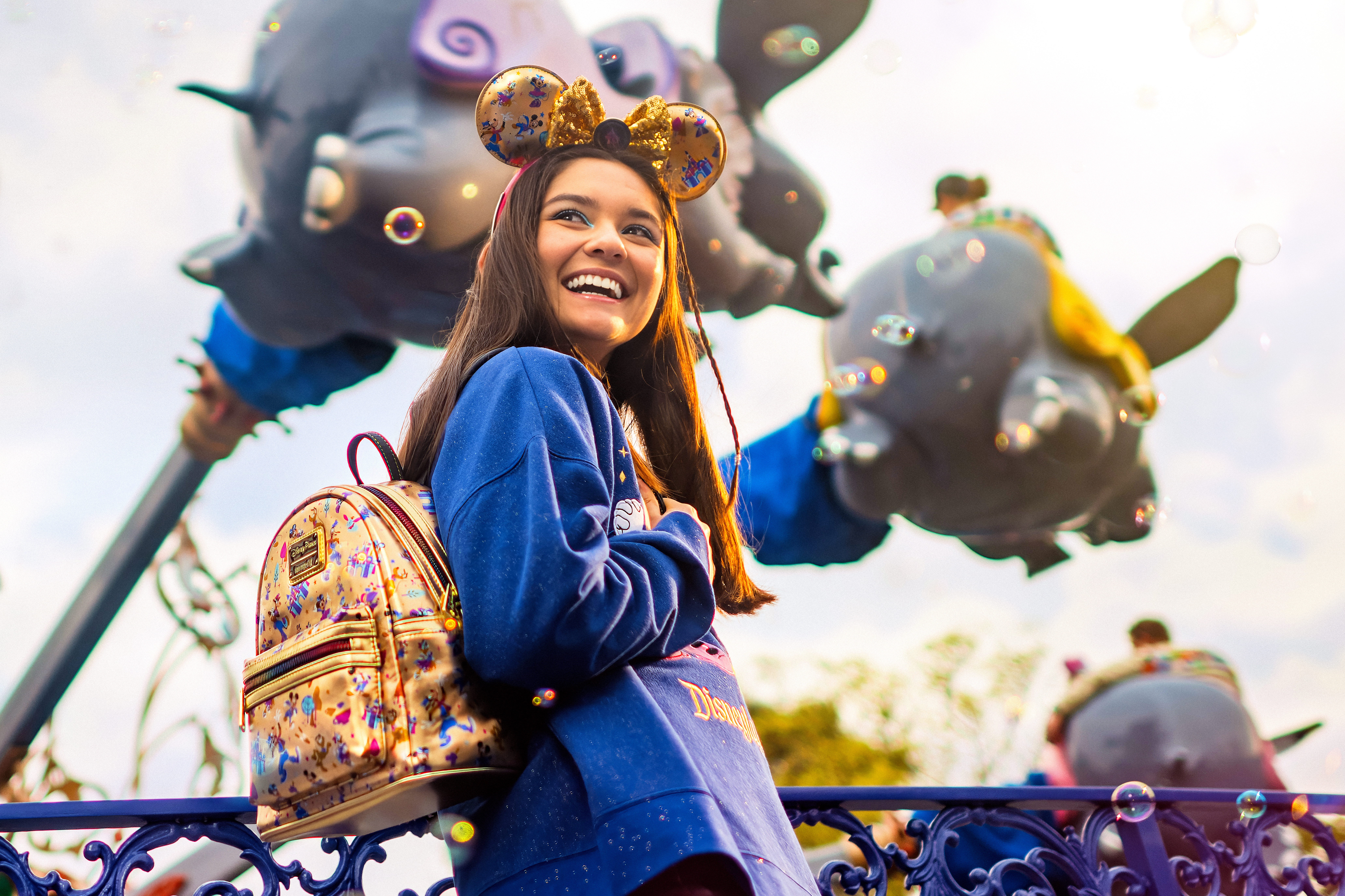 Girl wearing a Disney backpack